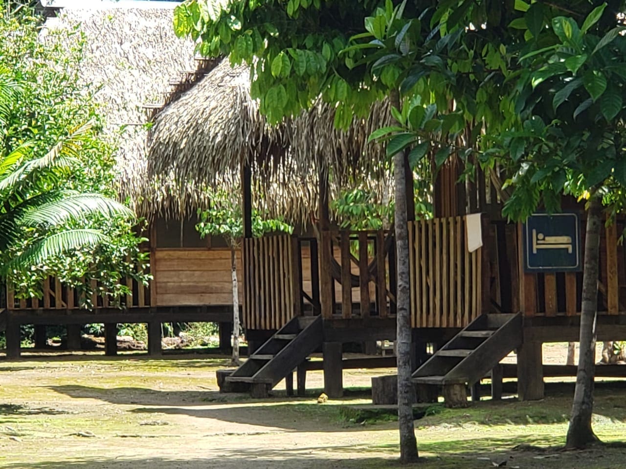 A simple cabin built from local products like wood and thatch